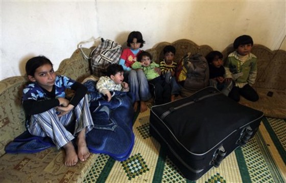 Syrian children gather at the house of their Lebanese relatives after fleeing the unrest in Syria's Wadi Khaled area, about 0.6 miles from the Lebanon-Syria border. When the Arab Spring came to Talkalakh, the little Syrian hill town a few minutes walk from the border village of Wadi Khaled, it seemed to last barely a moment. 